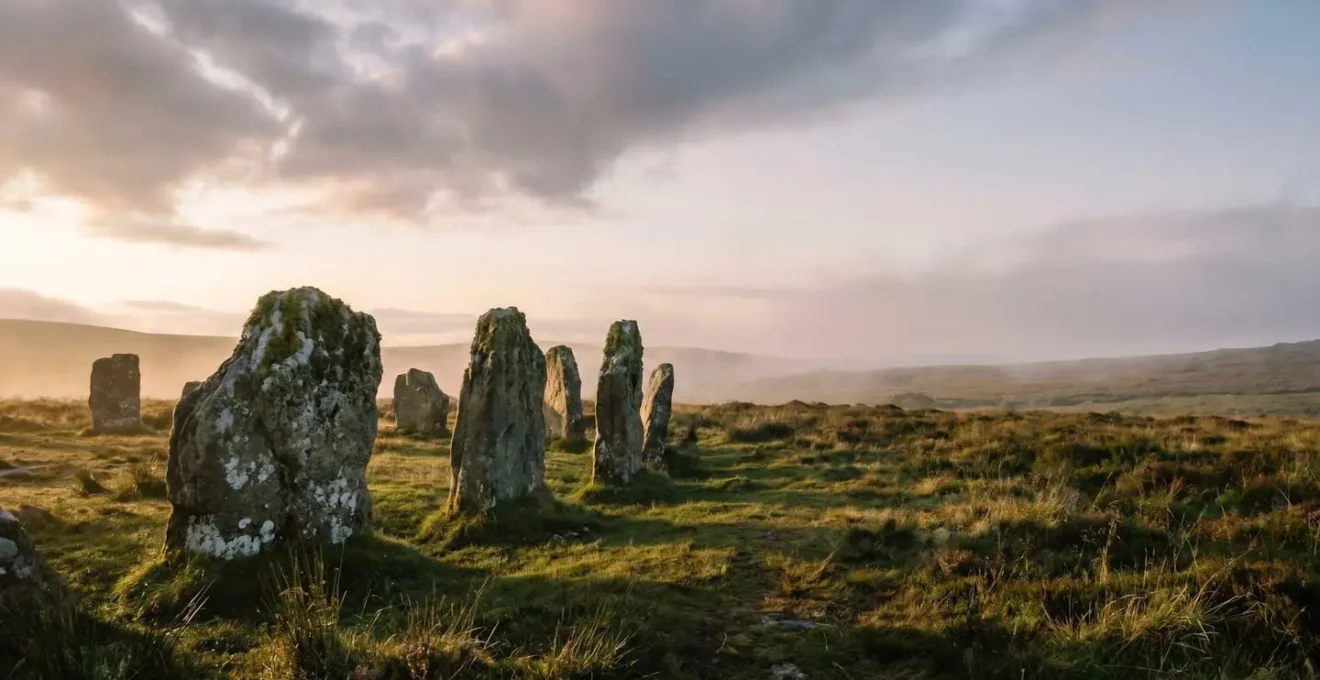 Atmospheric view of an ancient stone circle in misty British moorland at golden hour, capturing the essence of undiscovered heritage